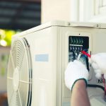 technician-using-measuring-tool-checking-electric-outdoor-air-compressor-min-scaled.jpg